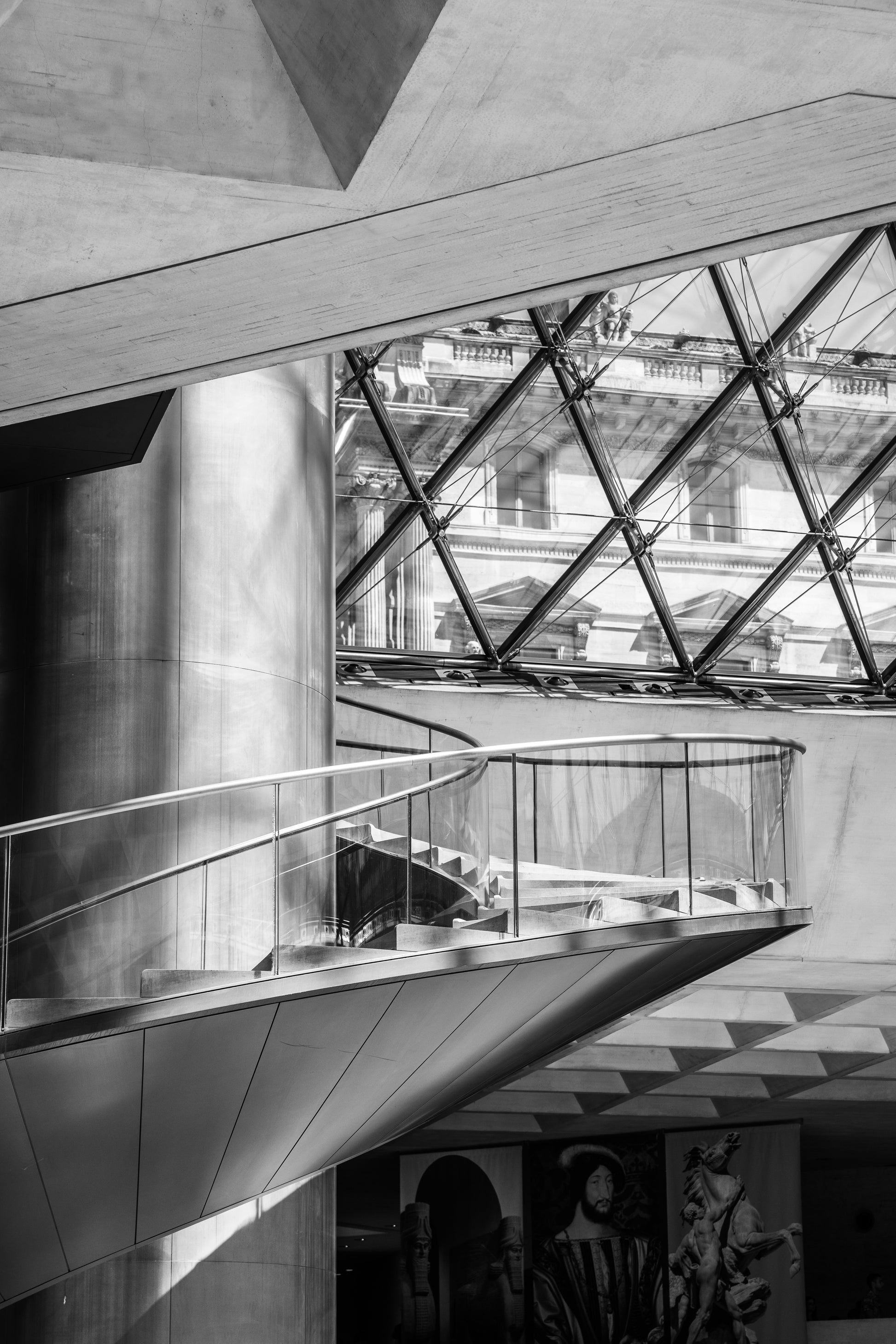 Modern architectural interior with a staircase and glass ceiling